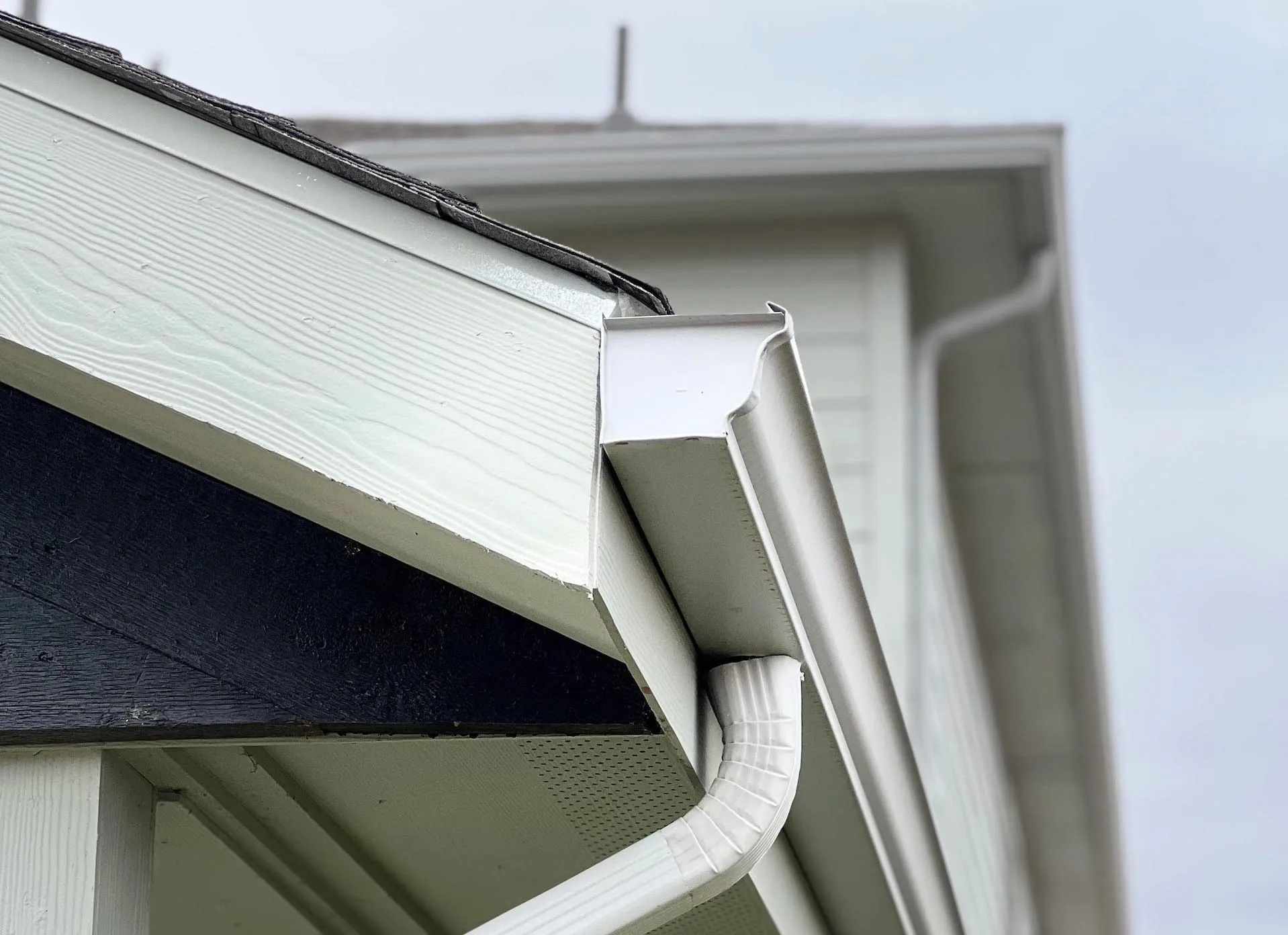 Custom seamless gutters professionally installed on a Texas home
